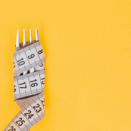 Measuring tape wrapped tight around a fork