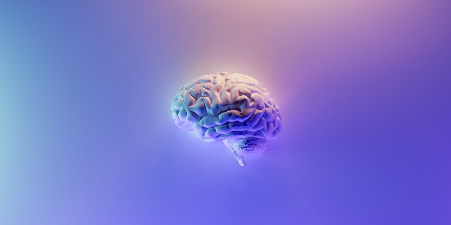 A brain floats in the center of a gradient purple background