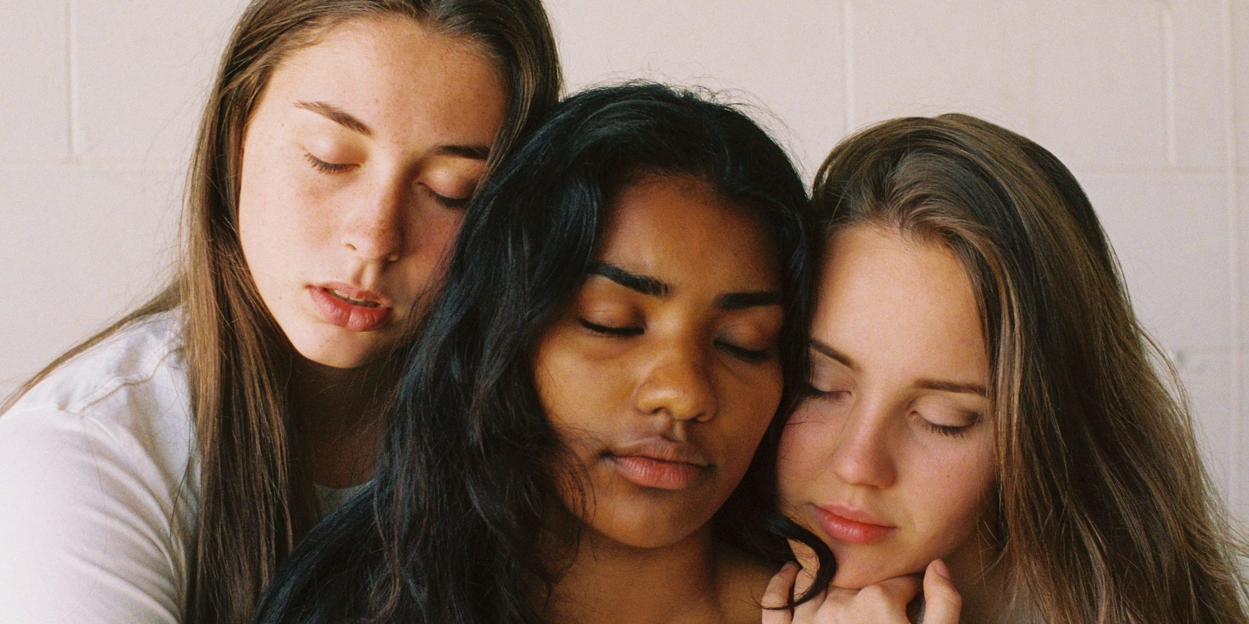 three people sitting beside each other